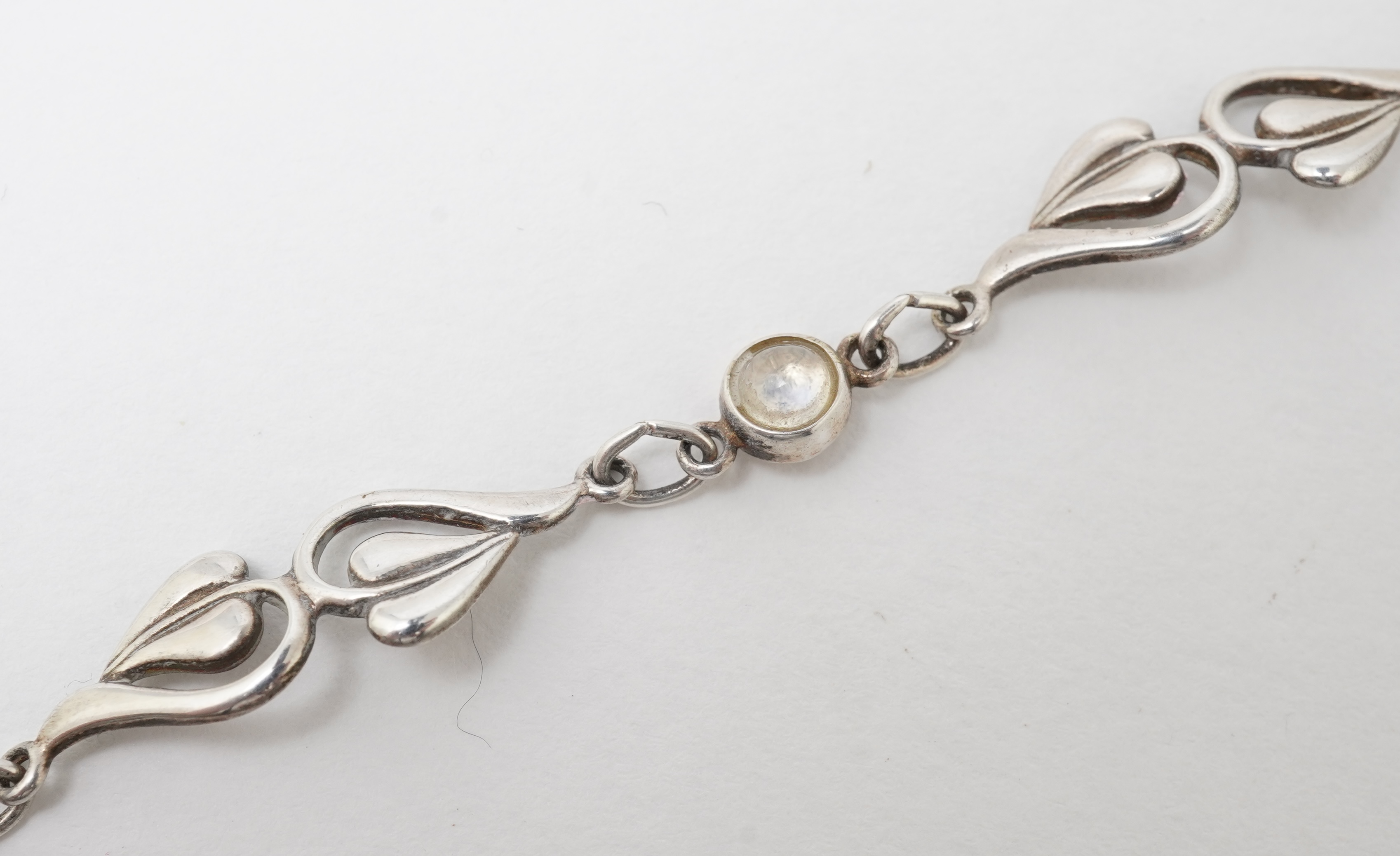 A collection of jewels and accessories including a moonstone bracelet